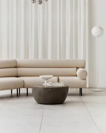 Blinde Design Curv 40 concrete coffee table centres a private residence living room, offering a sculptural round focal point for modern lounge style.